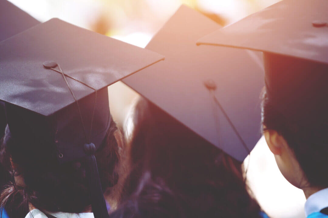 Close up of university graduates mortar boards