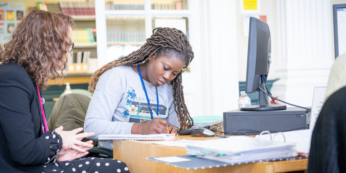 student and tutor working together