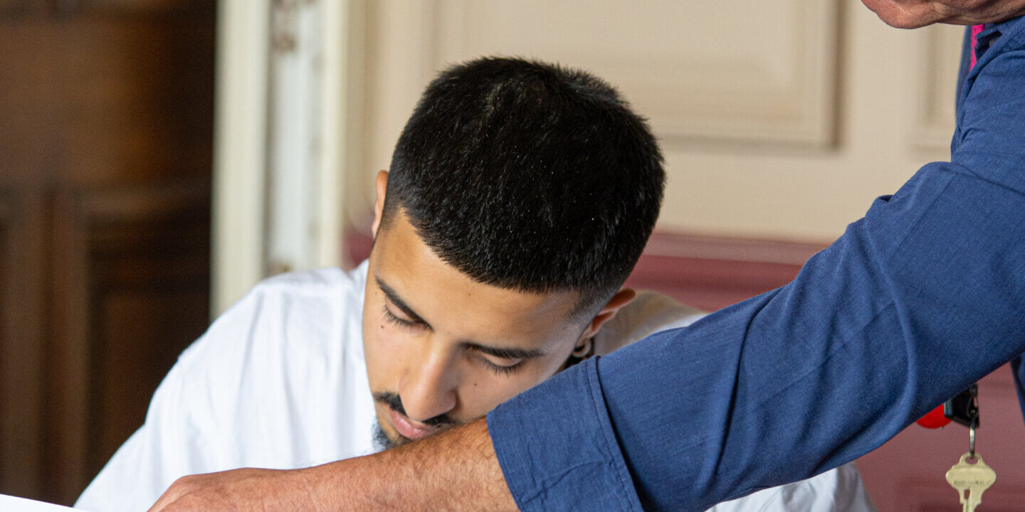 male student and tutor studying