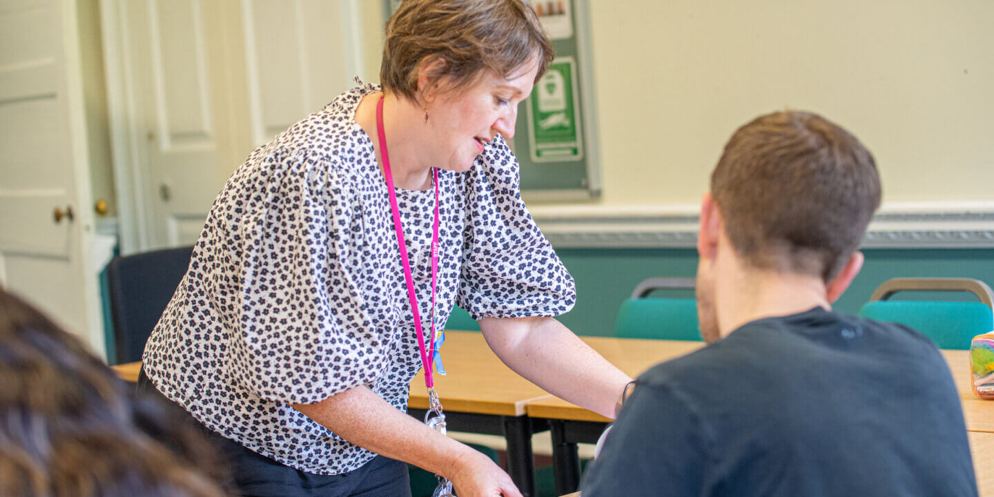 tutor and student reviewing work
