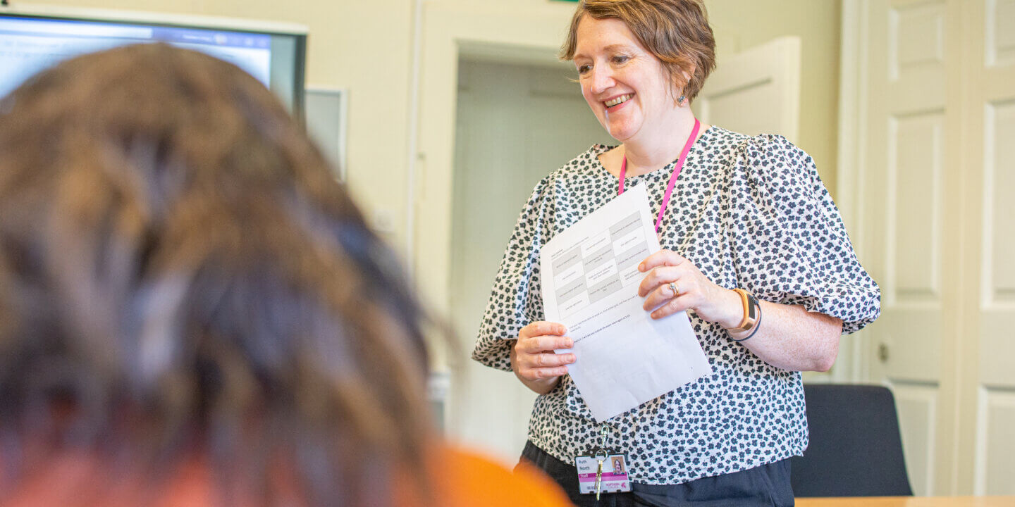 tutor with student smiling